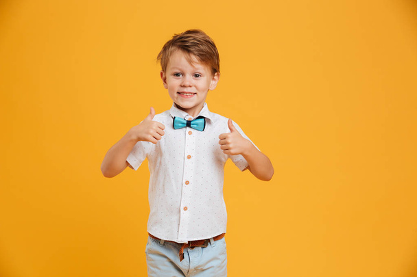 Little boy child standing isolated showing thumbs up. - Photo, Image