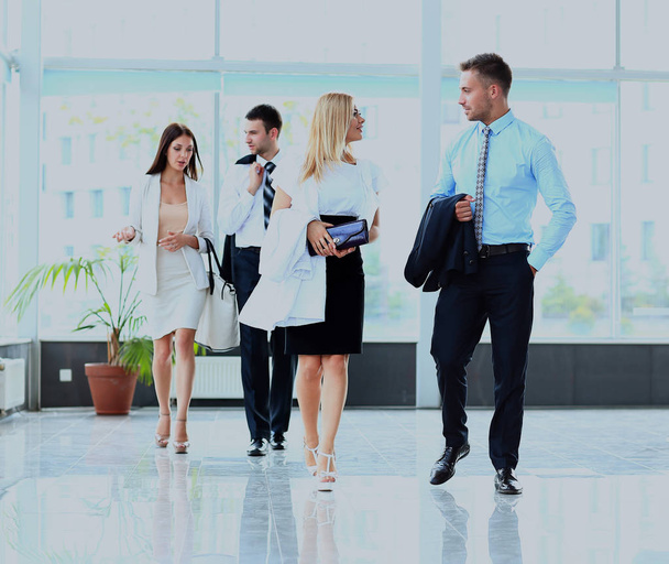 businesspeople group walking at modern bright office interior. - Foto, Imagen