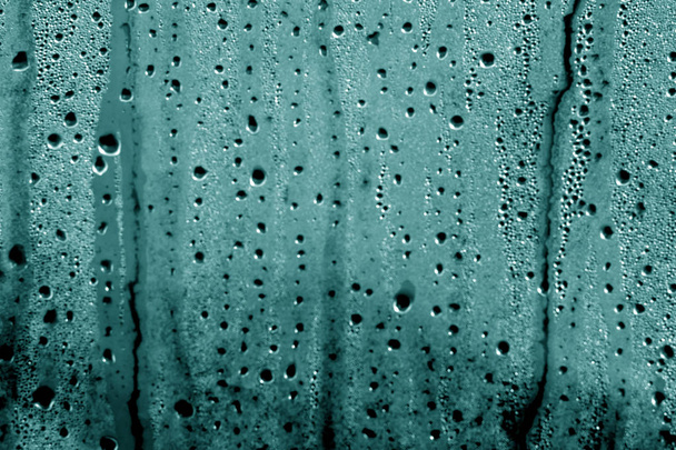 Condensation drops on PVC wrap in cyan color. - Photo, Image