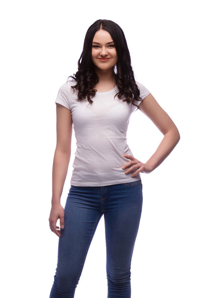 happy brunette young girl in blank t-shirt, isolated - Photo, Image