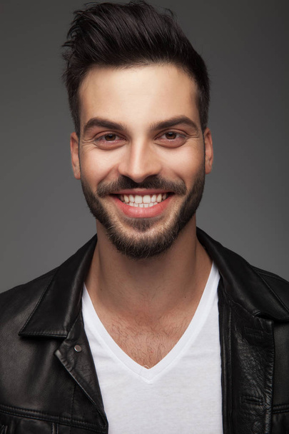 handsome young man in leather jacket is laughing  - Photo, Image