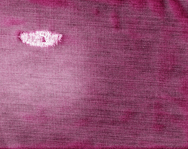 ジーンズ繊維テクスチャを引き裂かれたピンク色. - 写真・画像