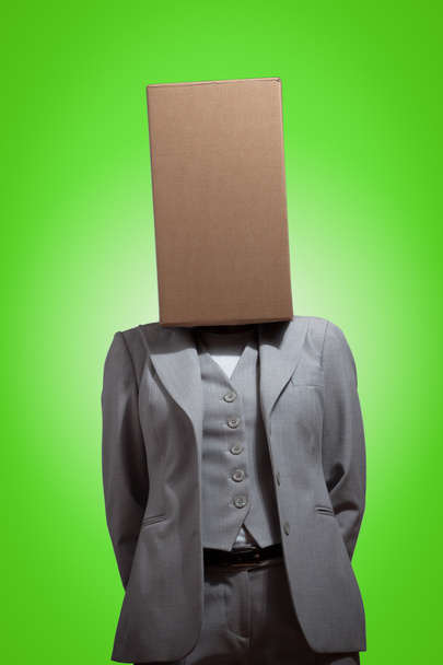Business woman with a cardboard box head - Photo, image