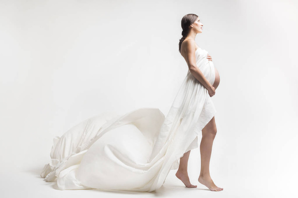 Young pregnant woman in studio - Zdjęcie, obraz