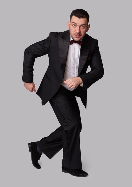 funny elegant man in black tuxedo - Фото, зображення