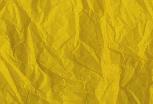 Crumpled yellow paper as background or texture - Φωτογραφία, εικόνα