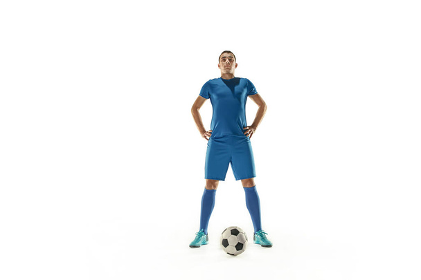 Professional football soccer player with ball isolated white background - Fotó, kép