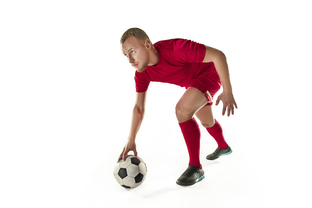 Professional football soccer player with ball isolated white background - Foto, afbeelding