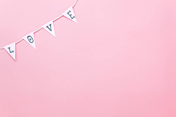 Table top view aerial image of valentine 's day background concept.Love text hang on rope clotheslines.Flat lay on modern rustic pink paper.pastel tone.Items create by handmade sign for the season. - 写真・画像