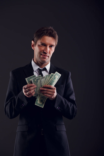 Image of banker in suit counting dollars - Fotoğraf, Görsel