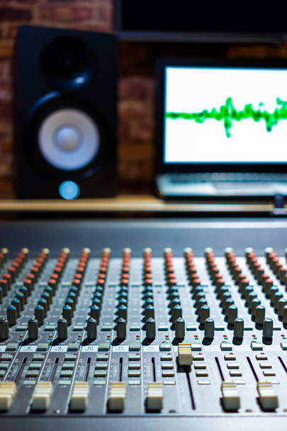 audio mixing console in recording, broadcasting studio. shallow dept of field, focus on knob - Fotoğraf, Görsel