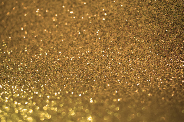 Glimmend goud patroon. Glitter Sparkle achtergrond - Foto, afbeelding