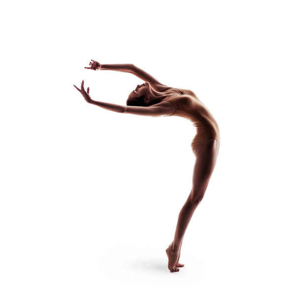 young beautiful dancer in beige swimsuit posing - Foto, Imagen