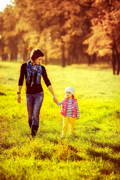 happy family mother and child little daughter walking on autumn  - Φωτογραφία, εικόνα
