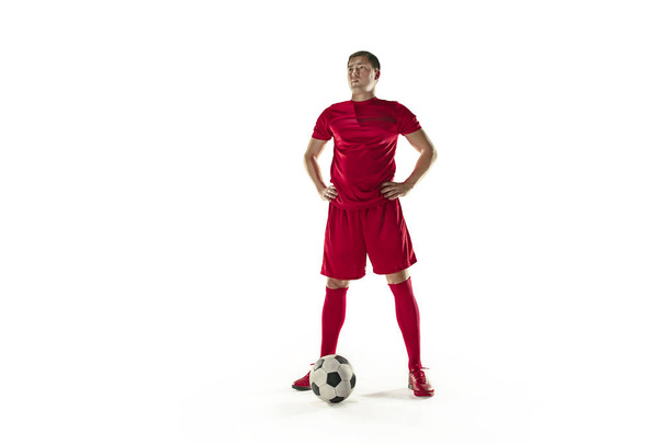 Professional football soccer player with ball isolated white background - Foto, afbeelding