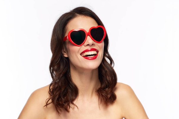 woman with red lipstick and heart shaped shades - Foto, imagen