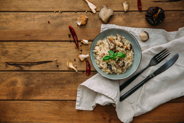 Mushroom risotto on white plate, close up view - Фото, изображение