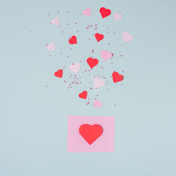 Valentines day background. Valentine card with paper hearts on the blue background - Foto, Imagem