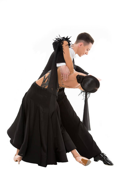 ballroom dance couple in a dance pose isolated on white background. ballroom sensual proffessional dancers dancing walz, tango, slowfox and quickstep - Fotografie, Obrázek