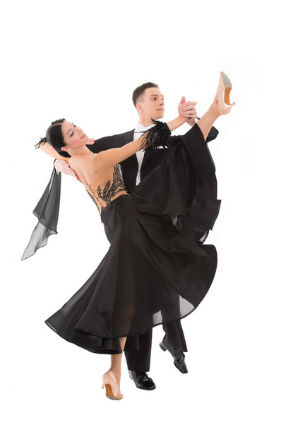 ballroom dance couple in a dance pose isolated on white background. ballroom sensual proffessional dancers dancing walz, tango, slowfox and quickstep - Fotoğraf, Görsel