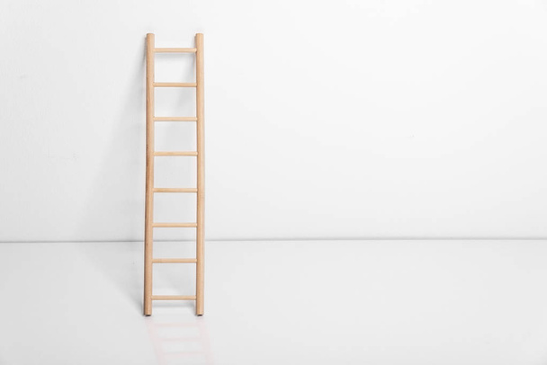 Wooden ladder leaning against the wall. - Photo, Image