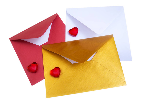 Group of open multicolored envelopes with red hearts. - Foto, Bild