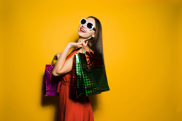happy woman with glasses with shopping bags - Photo, Image