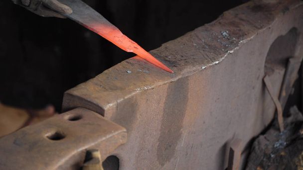 Blacksmith working metal with hammer. - Photo, Image