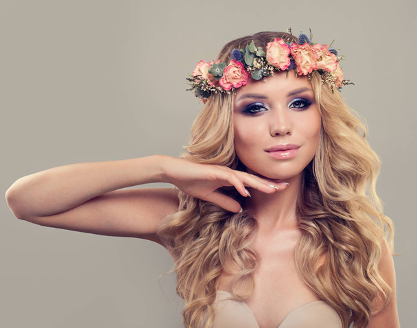 Beautiful Model with Spring Floral Wreath, Long Hair - Fotó, kép