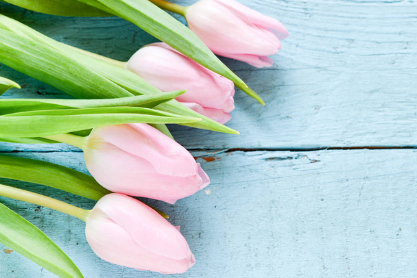 fresh pink tulips on wooden board - Fotó, kép