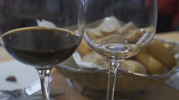 Man pouring wine into glasses at a party - Felvétel, videó