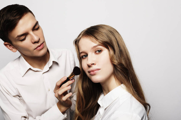 Young beautiful   woman applying make-up by make-up artist - Foto, Bild