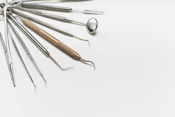 sterile dental tools lying on white background - Фото, изображение
