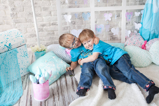 Cute brothers in a spring studio - Photo, Image