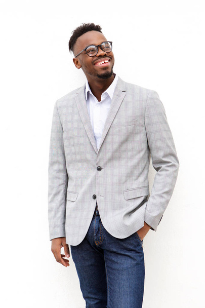Portrait of young black businessman with glasses against white background - Foto, afbeelding
