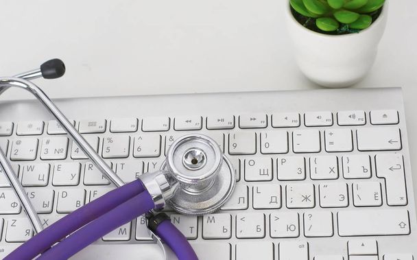 Close up of stethoscope on pc keyboard. Healthcare concept - Photo, Image