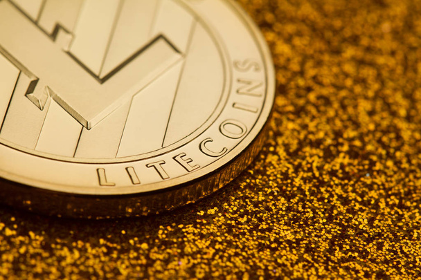single litecoin coin on golden glittering background - Photo, Image