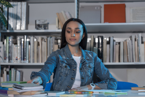 african american girl studying in library in evening - Photo, Image