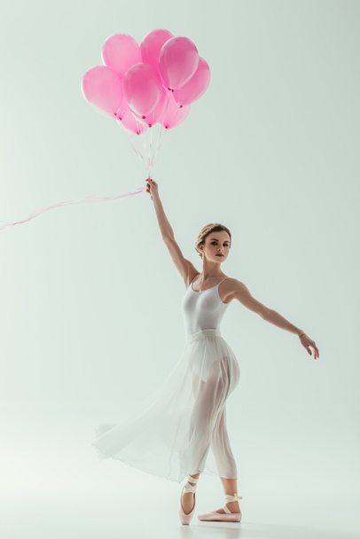 elegant ballerina with pink balloons, isolated on white - Φωτογραφία, εικόνα