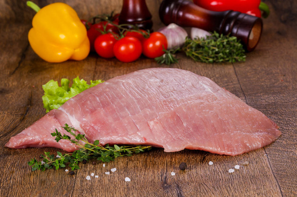 Raw pork meat over wooden background - Photo, Image