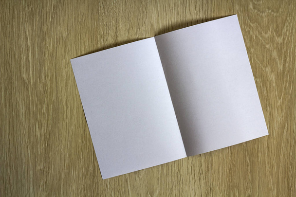 Blank white piece of paper on wooden background - Photo, Image