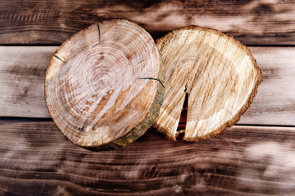 Two wooden cut texture on wooden background. - Zdjęcie, obraz