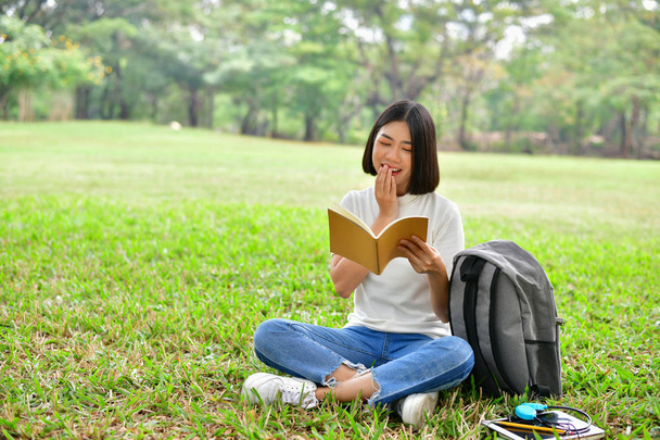 Education Concepts. Asian women reading books in the park. Beaut - Photo, Image