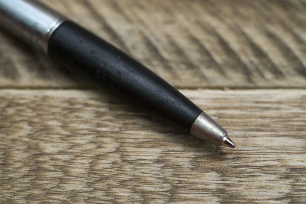 Close up of old pen on wooden background. - Foto, Imagen