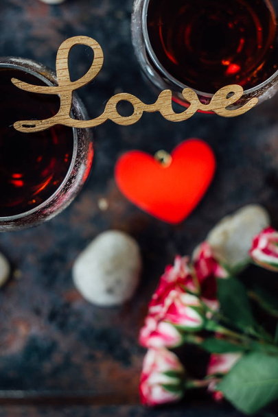 Beautiful letters LOVE on glasses of wine. - Photo, image