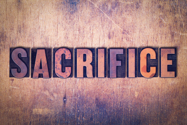 Sacrifice Theme Letterpress Word on Wood Background - Fotoğraf, Görsel