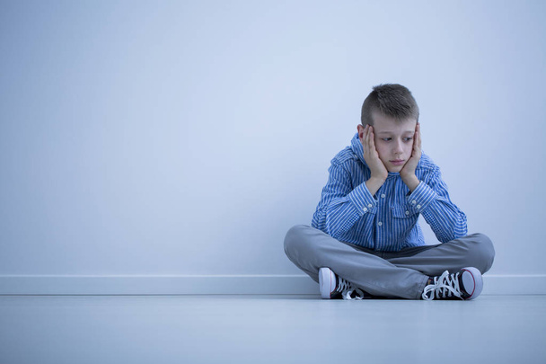 Depressed boy with Asperger syndrome - Foto, afbeelding