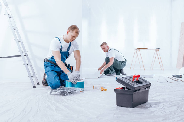 Home renovation crew finishing interior - Foto, Imagen