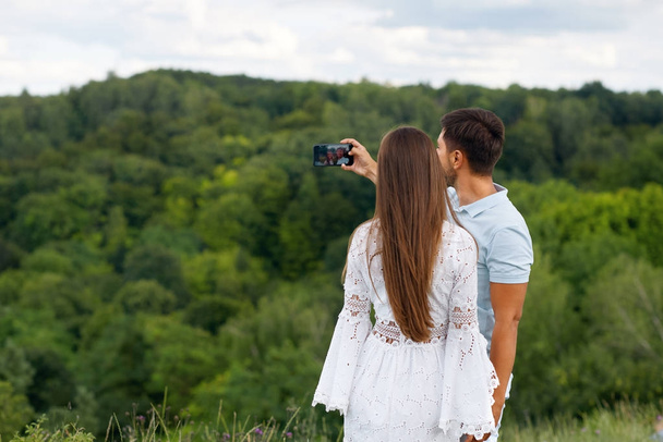 Romantic. Happy Couple In Love Taking Photos On Phone In Nature - Fotoğraf, Görsel