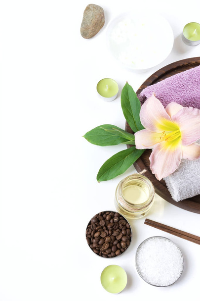 Spa setting of towel, flower, coffee beans on white background with copy space. Relax. - Fotografie, Obrázek